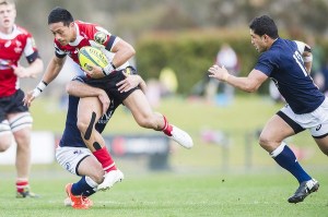Christian Lealiifano getting brought down against Qld Country. Photo by Jay Cronan