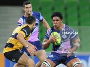 Lopeti Timani of the Rising runs the ball against Perth Spirit. Photo by Scott Barbour