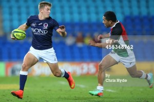 Tom Pincus running the ball for Queensland Country. Photo by Chris Hyde (Getty Images)